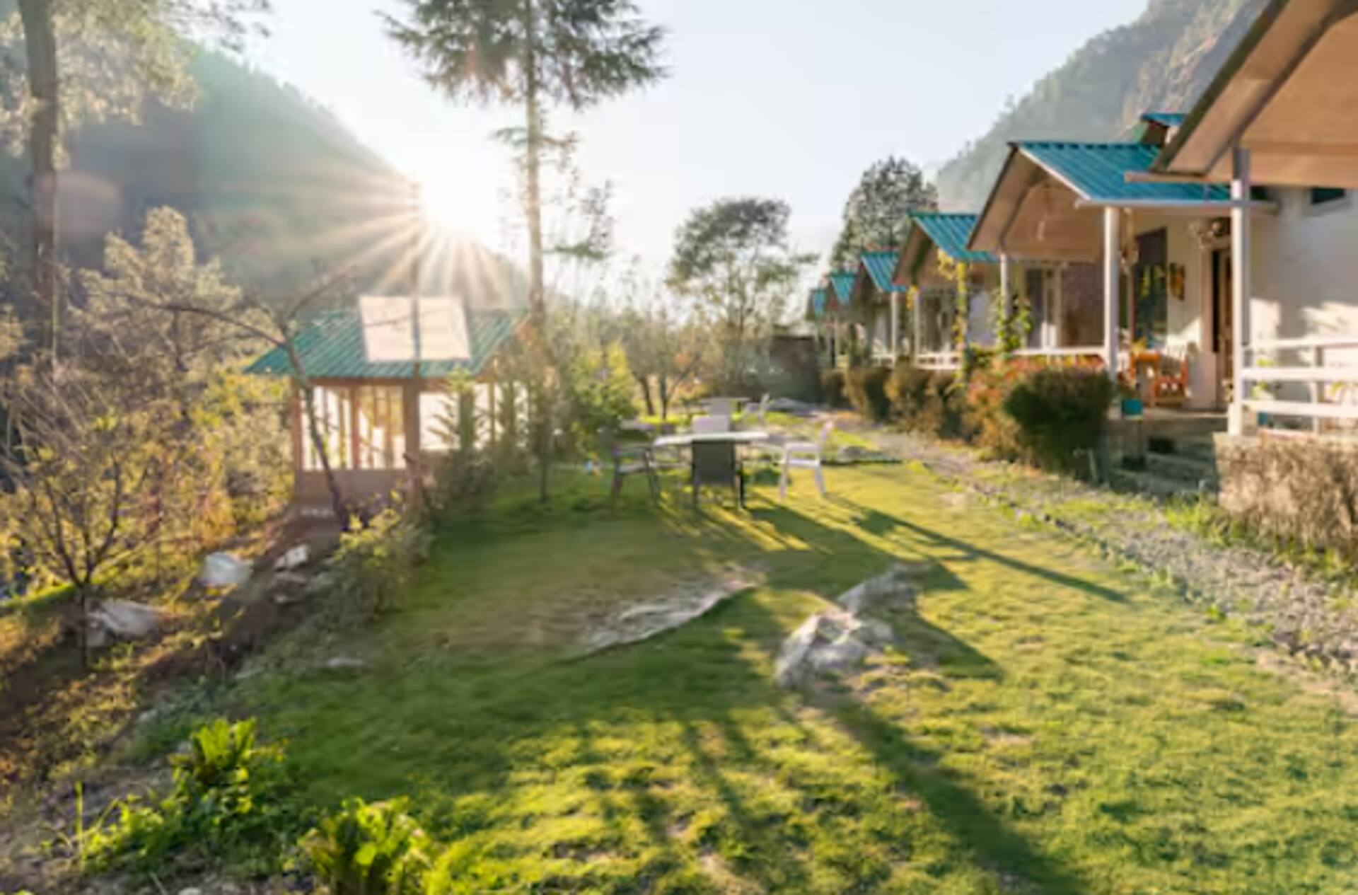 Morning sun across the garden and cottages